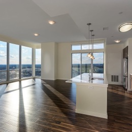 a kitchen with an island and wood floors