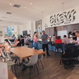 people in a clubroom for a community event