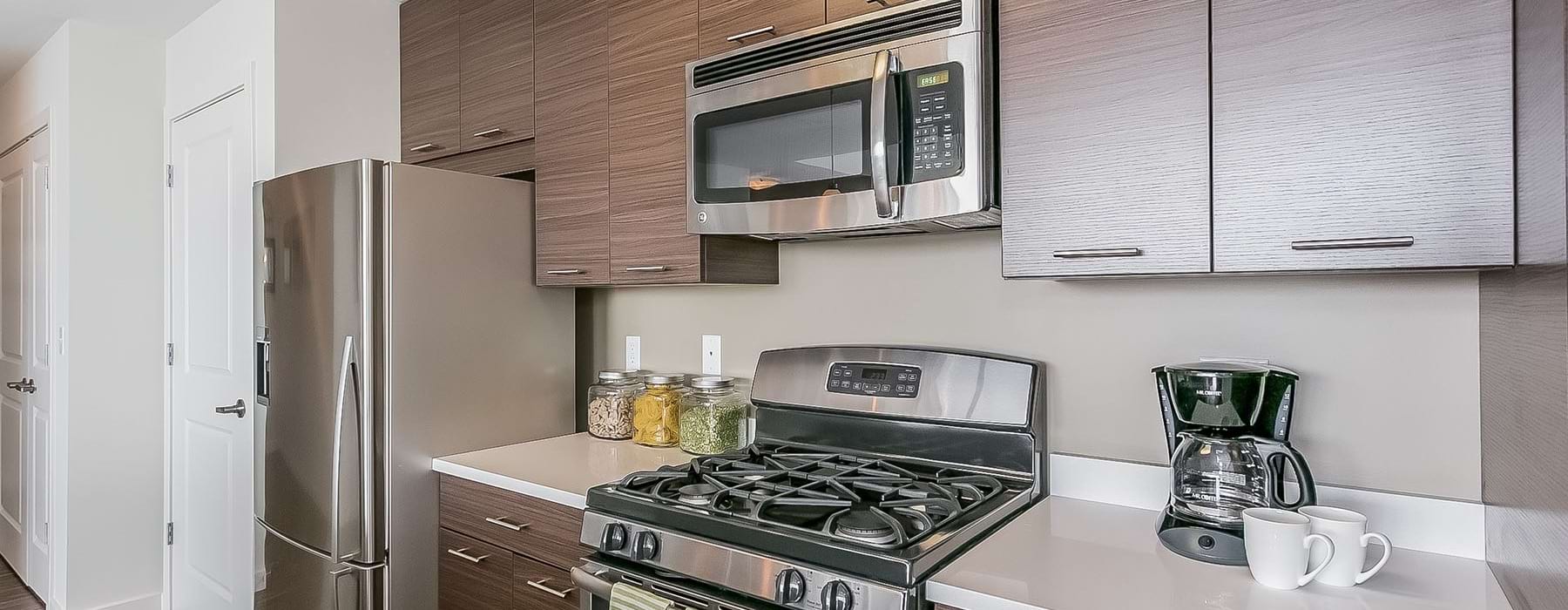 a kitchen with wooden cabinets