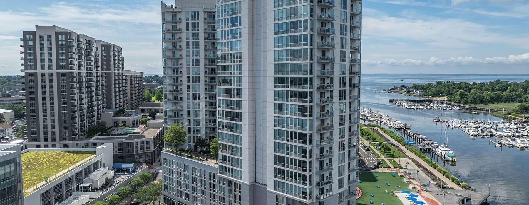 a tall building next to a river
